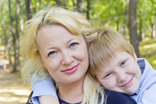 Portrait of European beautiful woman with son