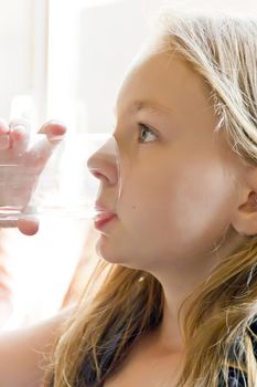 Portrait of Caucasian girl with white hair drinking water
