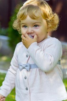 Photo of cute baby girl suckle nipple