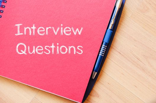 Interview questions text concept write on notebook