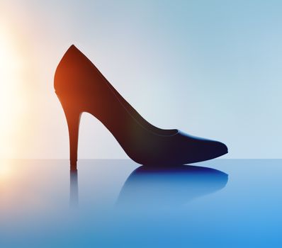 Women's black pump shoe in silhouette and with lens flare.