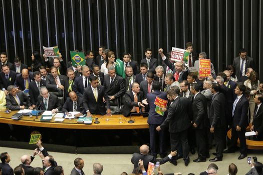 BRAZIL, Brasilia: Members of parliament gather for the impeachment proceedings on April 17, 2016 in Brasilia, Brazil.Brazil's lower house is voting on whether to continue impeachment proceedings. 342 out of 513 votes are needed to continue the proceedings to the upper house.