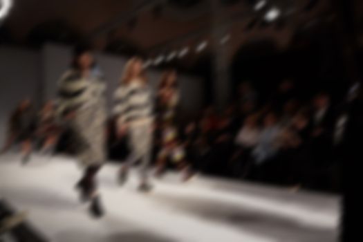 Fashion runway out of focus. The blur background