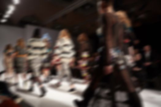 Fashion runway out of focus. The blur background