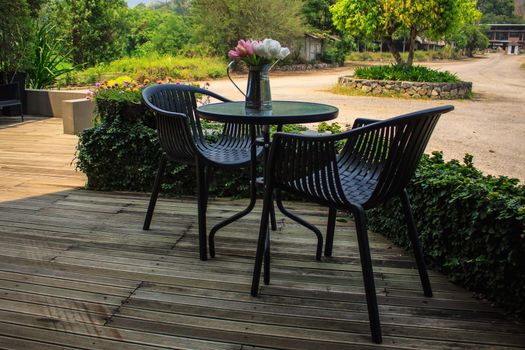 Outdoor furniture of tables and chairs with flowerpot