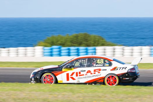 PHILLIP ISLAND, MELBOURNE/AUSTRALIA - 17 APRIL 2016: Dunlop Series race cars exiting turn 6 at Phillip Island.