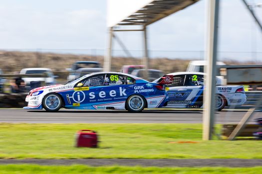 PHILLIP ISLAND, MELBOURNE/AUSTRALIA - 17 APRIL 2016: Dunlop Series race cars exiting turn 6 at Phillip Island.