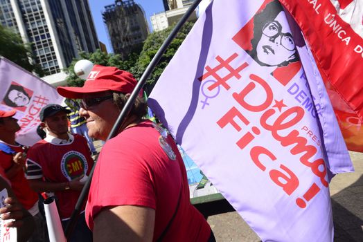 BRAZIL, Sao Paulo: Supporters of Brazilian President Dilma Rousseff demonstrate in Sao Paulo, before the voting of lawmakers at the Congress in Brasilia over the impeachment of Rousseff, on April 17, 2016. Brazilian lawmakers on Sunday reached the two thirds majority necessary to authorize impeachment proceedings against President Dilma Rousseff. The lower house vote sends Rousseff's case to the Senate, which can vote to open a trial. A two thirds majority in the upper house would eject her from office. Rousseff, whose approval rating has plunged to a dismal 10 percent, faces charges of embellishing public accounts to mask the budget deficit during her 2014 reelection.