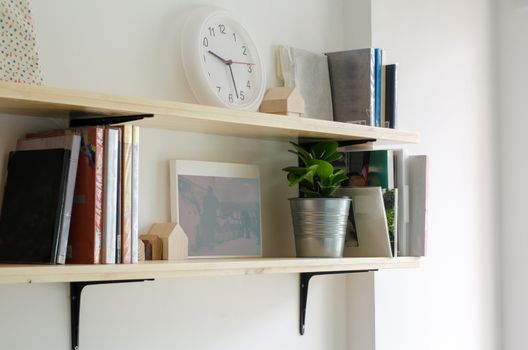 Books on a wooden shelf. Interior design