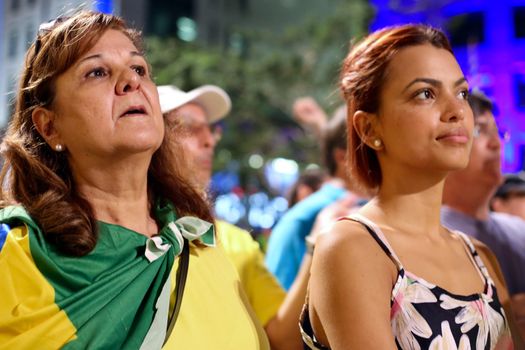 BRAZIl, Sao Paulo: Women are pictured on the Avenida Paulista as thousands of activists supporting the impeachment of President Dilma Rousseff take part in a protest in Sao Paulo, on April 17, 2016. Brazilian lawmakers on Sunday reached the two thirds majority necessary to authorize impeachment proceedings against President Dilma Rousseff. The lower house vote sends Rousseff's case to the Senate, which can vote to open a trial. A two thirds majority in the upper house would eject her from office. Rousseff, whose approval rating has plunged to a dismal 10 percent, faces charges of embellishing public accounts to mask the budget deficit during her 2014 reelection.