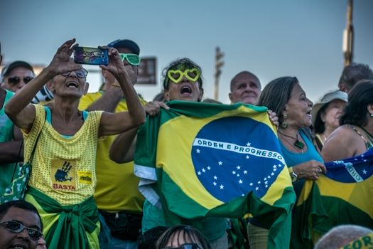 BRAZIL, Rio de Janeiro: People take part in a demonstration in favor of the impeachment of President Dilma Rousseff, in Copacabana, Rio de Janeiro, on April 17, 2016. Brazilian lawmakers on Sunday reached the two thirds majority necessary to authorize impeachment proceedings against President Dilma Rousseff. The lower house vote sends Rousseff's case to the Senate, which can vote to open a trial. A two thirds majority in the upper house would eject her from office. Rousseff, whose approval rating has plunged to a dismal 10 percent, faces charges of embellishing public accounts to mask the budget deficit during her 2014 reelection.