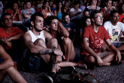 BRAZIL, Curitiba: Activists supporting Brazilian President Dilma Rousseff follow on a big screen as lawmakers vote on whether the impeachment of Rousseff will move forward, in Curitiba, southern Brazil, on April 17, 2016. Brazilian lawmakers on Sunday reached the two thirds majority necessary to authorize impeachment proceedings against President Dilma Rousseff. The lower house vote sends Rousseff's case to the Senate, which can vote to open a trial. A two thirds majority in the upper house would eject her from office. Rousseff, whose approval rating has plunged to a dismal 10 percent, faces charges of embellishing public accounts to mask the budget deficit during her 2014 reelection.