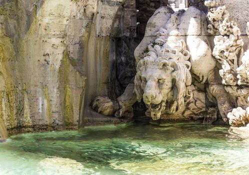 statue of a lion near the water