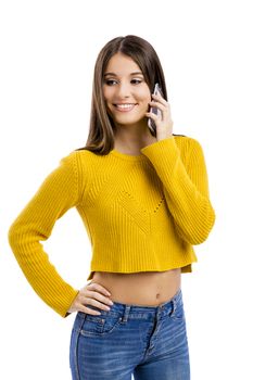 Beautiful girl making a phone call, isolated over white background