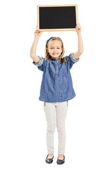 Cute little girl holding a chalkboard, isolated on white