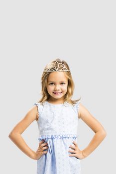 Portrait of a cute happy little girl wearing a princess crown