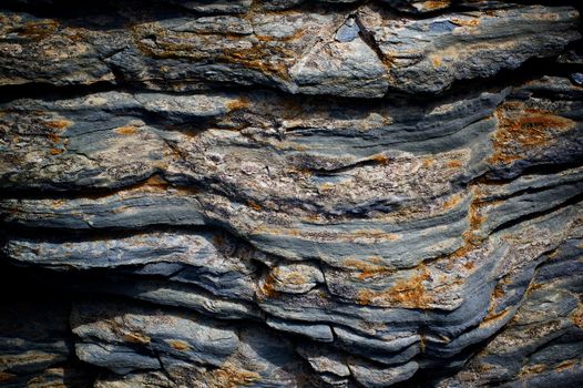 Background of Textured Shale Stone with Weathered Open-pit closeup Outdoors