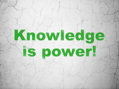 Education concept: Green Knowledge Is power! on textured concrete wall background