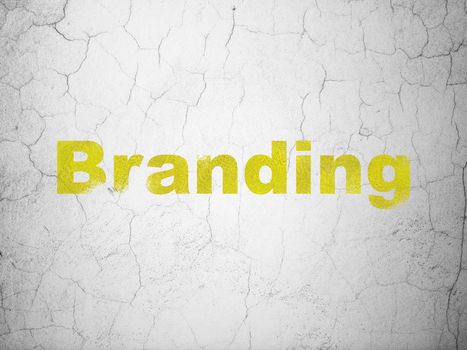 Advertising concept: Yellow Branding on textured concrete wall background