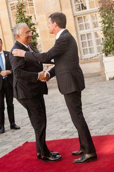 FRANCE, Paris : French Prime Minister Manuel Valls (R) welcomes his Portuguese counterpart Antonio Costa at the Hotel Matignon on April 18, 2016 in Paris. 
