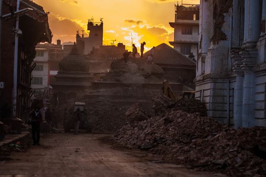 NEPAL,Kathmandu: Vehicles are used to clear the streets of rubble in Kathmandu's Durbar Square on April 29, 2015, after a magnitude 7.8 earthquake hit the area.More than 8,000 people died in the quake and some 3.5 million were left homeless. 