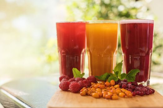 set of fruit non-alcoholic drink with cranberries raspberries and sea buckthorn