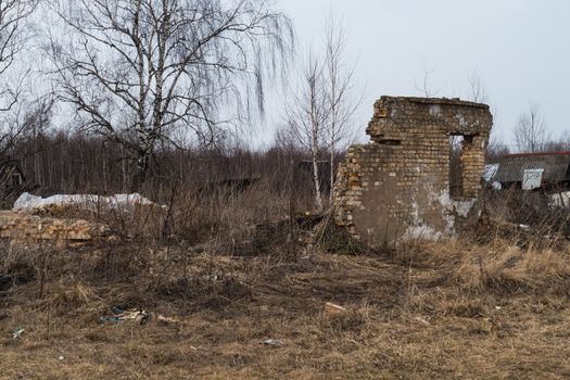 Wall ruined brick house in a village 9.4.2016