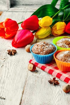 Sweet muffin tins and bouquet of fresh cut tulips