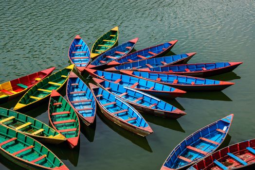 Colorful small boats on Phewa Lake in Pokhara, Nepal