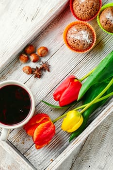 muffin tins and bouquet of fresh cut tulips