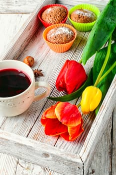 muffin tins and bouquet of fresh cut tulips