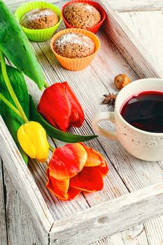 muffin tins and bouquet of fresh cut tulips