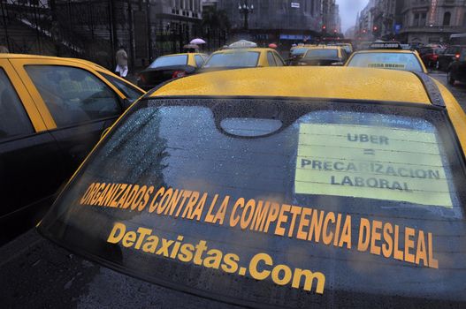 ARGENTINA, Buenos Aires: Cabs block the avenue outside the National Congress as taxi drivers protest against Uber in Buenos Aires on April 18, 2016.Uber started operating in Buenos Aires Tuesday without official permission, unleashing a war with taxi drivers who blocked avenues in a protest that caused traffic chaos.