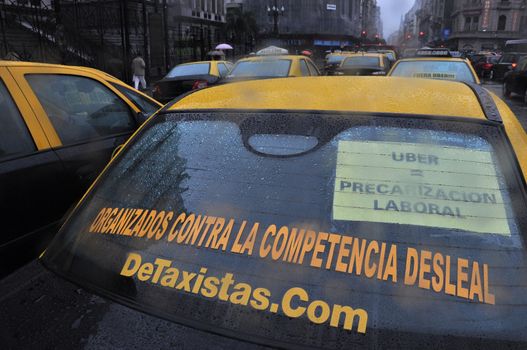 ARGENTINA, Buenos Aires: Cabs block the avenue outside the National Congress as taxi drivers protest against Uber in Buenos Aires on April 18, 2016.Uber started operating in Buenos Aires Tuesday without official permission, unleashing a war with taxi drivers who blocked avenues in a protest that caused traffic chaos.