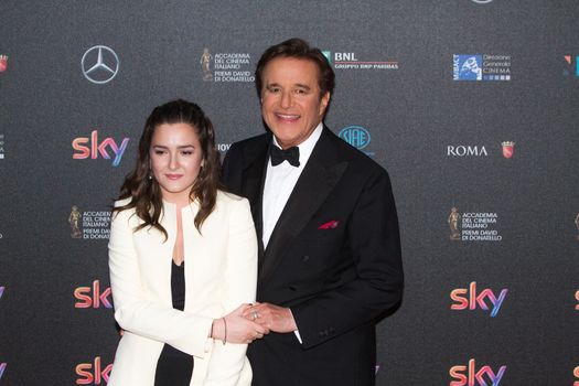 ITALY, Rome: Actor Christian De Sica and Maria Rosa De Sica arrive at the 60. David di Donatello ceremony on April 18, 2016 in Rome, Italy. 