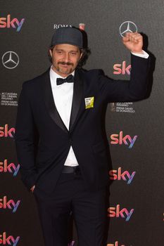 ITALY, Rome: Actor Claudio Santamaria poses with his David di Donatello award for Best Actor at the 60. David di Donatello ceremony on April 18, 2016 in Rome, Italy. 