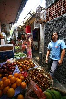 Bali, Indonesia - October 24, 2007: Residents of Bali are selling fruit on the open market on the streets of Bali. Indonesia