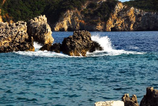 rocks surrounded by clear blue Ionian sea in Greece