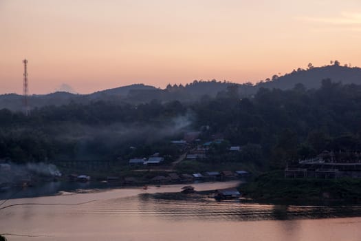 River and houseboat in duration twilight at winter season