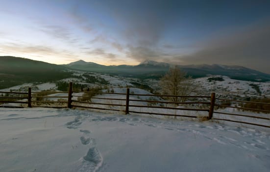 Carpathian mountain valley covered with fresh snow. Majestic landscape. Ukraine, Europe