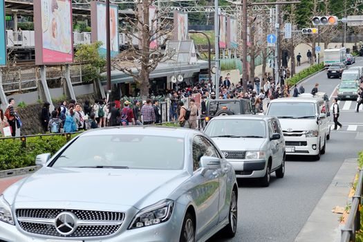 TOKYO, JAPAN - MARCH 30 2016: Traffic jam on the main crossroad of Harajuku shopping street on MARCH 30, 2016 in Tokyo, Harajuku is known as a center of Japanese youth culture and fashion.
