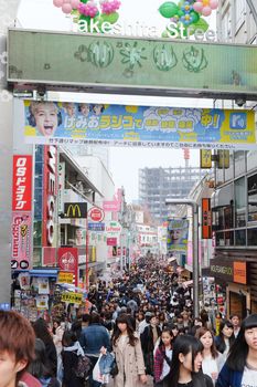 TOKYO, JAPAN - MARCH 30 2016: Takeshita Street(Takeshita Dori) in Harajuku. Takeshita Dori is considered a birthplace of Japan's fashion trends.