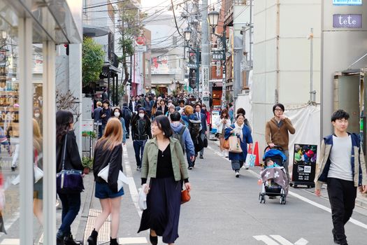 Tokyo, Japan - March 30, 2016 : Tourists and business people in Ura-Harajuku street,Harajuku is known as a center of Japanese youth culture and fashion.
