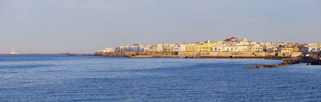 Gallipoli lighthouse and city panorama in the morning. Gallipoli, Apulia, Italy