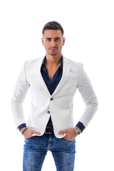 Attractive young man in suit with elegant white jacket and jeans, isolated on white