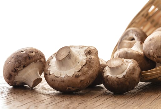 raw natural mushrooms champignon on a wooden board
