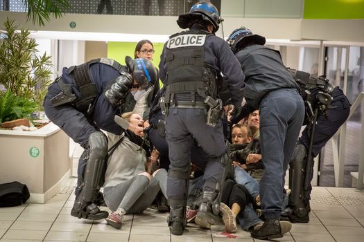 FRANCE, Toulouse: Policemen evacuate activist who occupy a BNP bank branch to protest against tax haven, in Toulouse, southern France, on April 20, 2016.