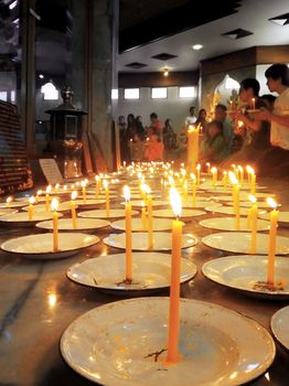 Khao Kho District, Phetchabun, THAILAND - DECEMBER 10, 2012 : Buddhists l lighting candles to worship the Buddha at Kanchanapisek Pagoda,Khao Kho District, Phetchabun, THAILAND