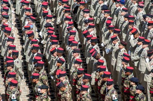 FRANCE, Paris : Soldiers hold a minute of silence for three French soldiers killed in northern Mali, during a solemn and national tribute ceremony at the Hotel des Invalides in Paris, on April 20, 2016.Three French peacekeeping soldiers died after their armoured car ran over a landmine in Mali, the French presidency said April 13, 2016. One soldier, Mickael Poo-Sing, was killed immediately in the blast on April 12, 2016 and President Francois Hollande learned with great sadness that two more soldiers had died in the west African country, a statement said. The car was leading a convoy of around 60 vehicles travelling to the northern desert town of Tessalit when it hit the mine, according to the French defence ministry. The troops were part of Operation Barkhane, under which France has some 3,500 soldiers deployed across five countries in the Sahel region, south of the Sahara desert, to combat the jihadist insurgency raging there.