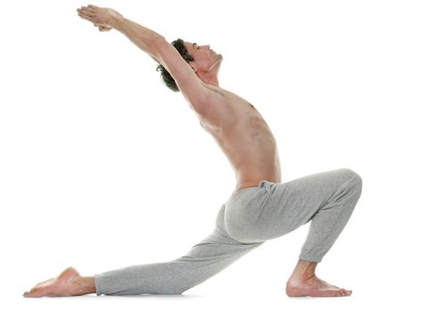 man doing yoga in front of white background